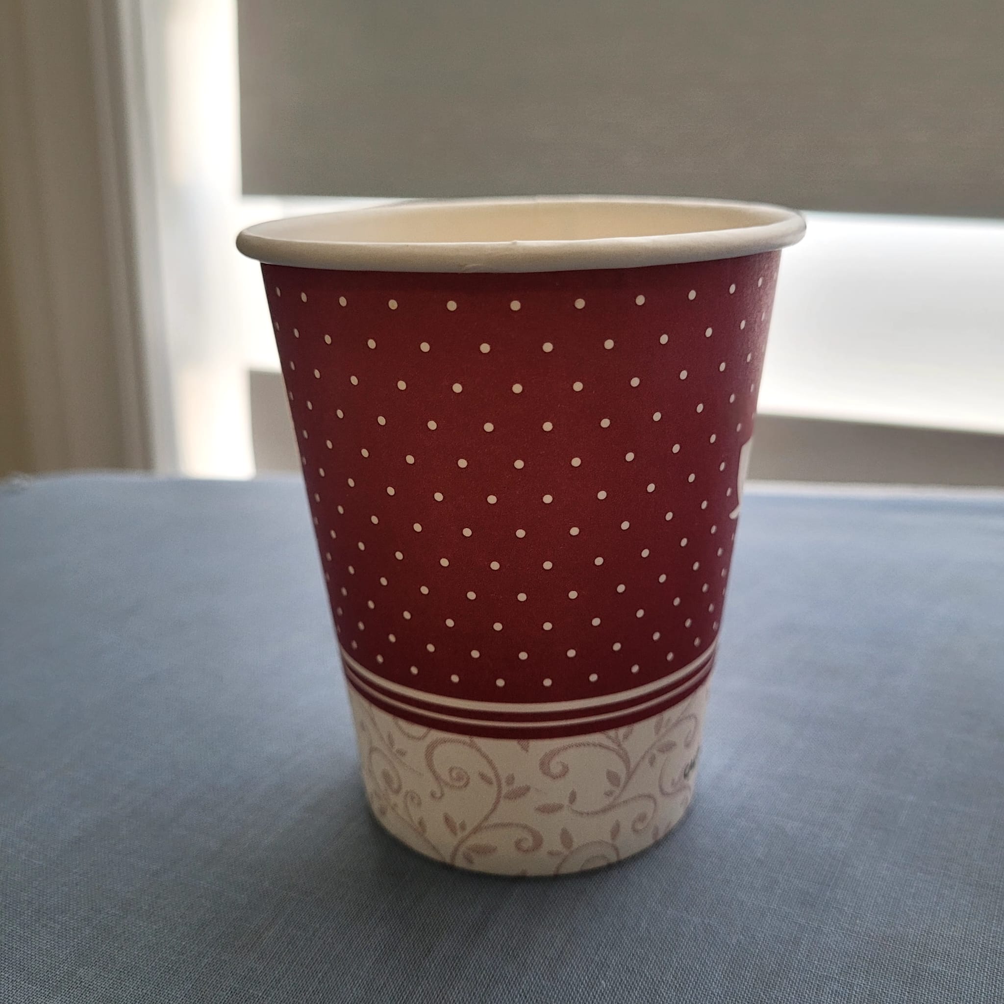 Red paper cup with dots